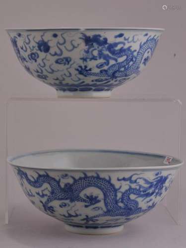 Pair of porcelain bowls. China. 19th to early 20th century. Underglaze blue decoration of dragons and pearls. K'ang H si mark.   6-3/8