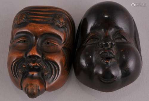 Two Japanese carved wood faced mask Netsukes. Largest- 1-11/16
