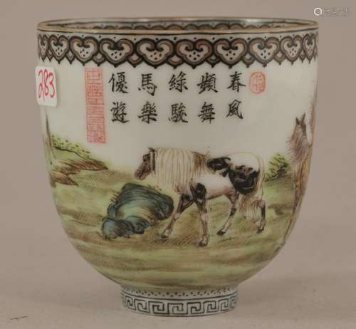 Porcelain cup. China. Republic Period. Circa 1930. Famille decoration of graying horses. Ch'ien Lung mark on the base. 2-3/8