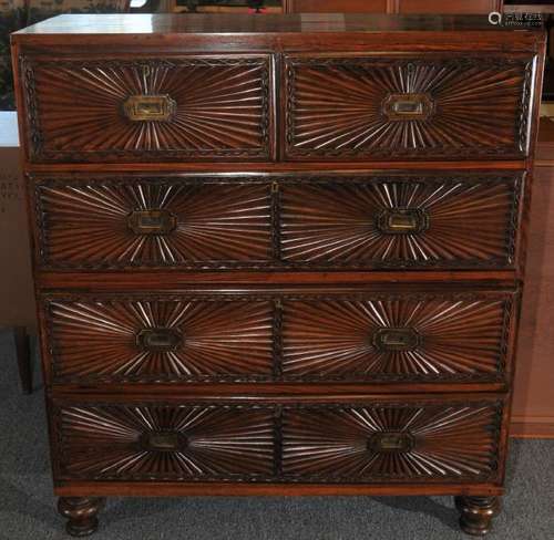 19th century Anglo Indian exotic carved wood five drawer two-part campaign chest on turned legs. Inset brass handles. Fan carved drawer fronts. Two short over three long drawers.  40