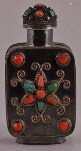 Silver snuff bottle. China. Early 20th century. Mongol style. Inlay of coral and turquoise. 2-7/8