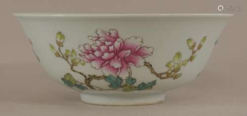 Porcelain bowl. China. 19th century. Famille Rose decoration of various flowers. Six-character Ch'ien Lung mark in underglaze blue.   5 7/8