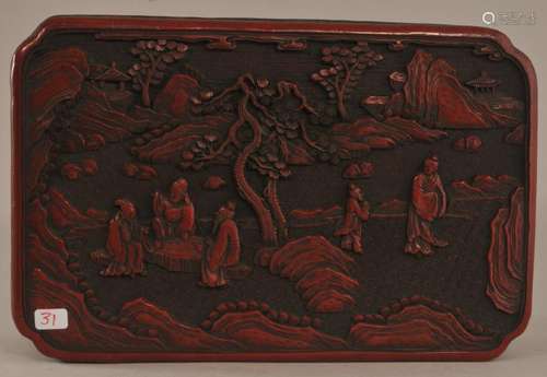 Rectangular box. China. 19th century. Surface of cinnebar lacquer carved with a gathering of scholars in a landscape. 8