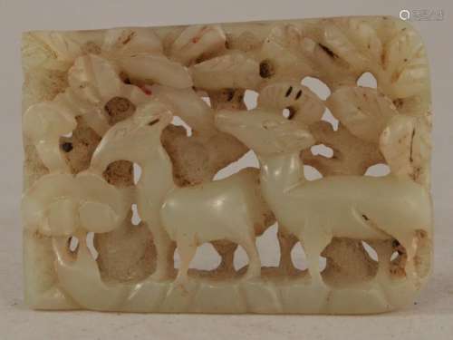 Jade belt plaque. China. Ming period. (1368-1644). Stone of a grey white colour. Two deer in a pine forest.  1-3/8