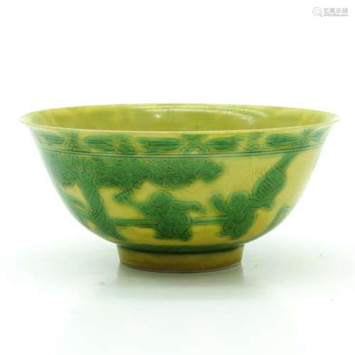 A Yellow and Green Bowl Depicting Chinese men in g...