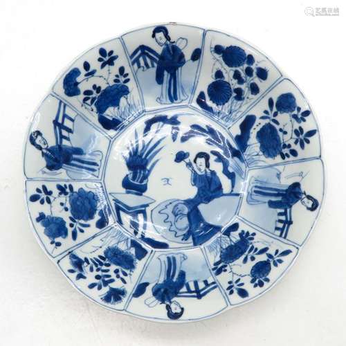 A Blue and White Plate Depicting alternating scene...