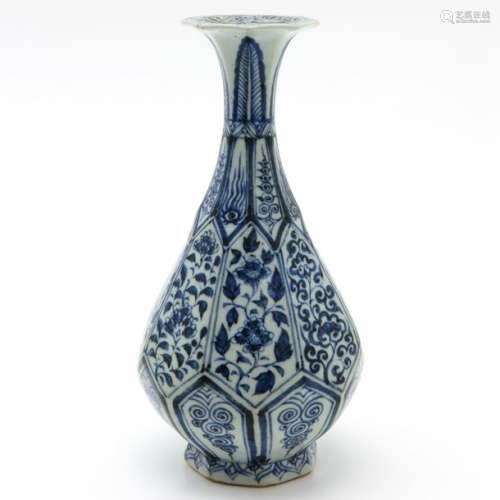 A Blue and White Vase Floral decor, 27 cm. Tall.	...