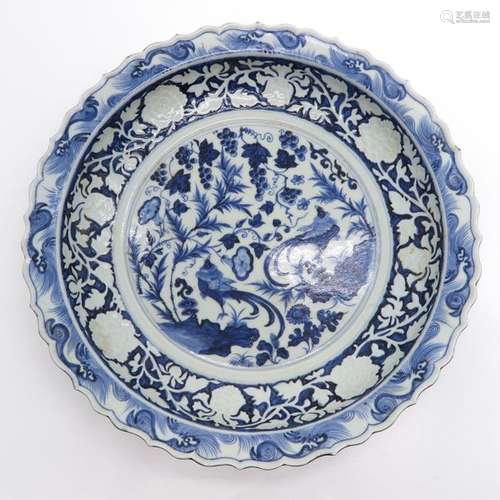 A Large Blue and White Charger Depicting flowers a...