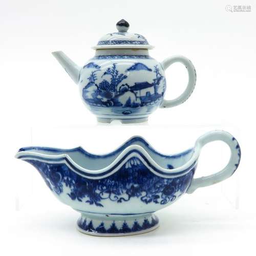 A Blue and White Teapot and Gravy Boat Landscape a...