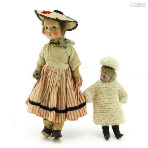 A Lot of 2 Antique Dolls Including one bisque head...
