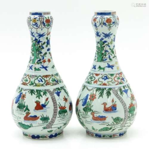 A Pair of Wucai Decor Garlic Head Vases Depicting ...