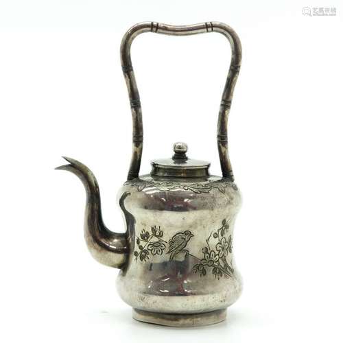 An Engraved Teapot Depicting bird with flowers, ba...