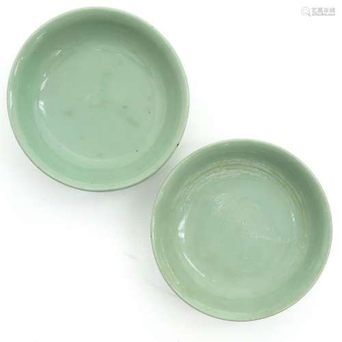 A Pair of Celadon Plates On small circular foot, 1...