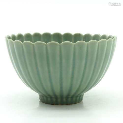 A Celadon Scalloped Rim Bowl On small circular foo...