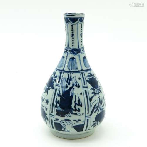 A Blue and White Vase Depicting florals and animal...