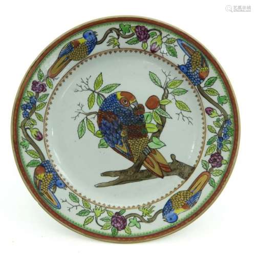A Polychrome and Gilt Decor Plate Depicting parrot...
