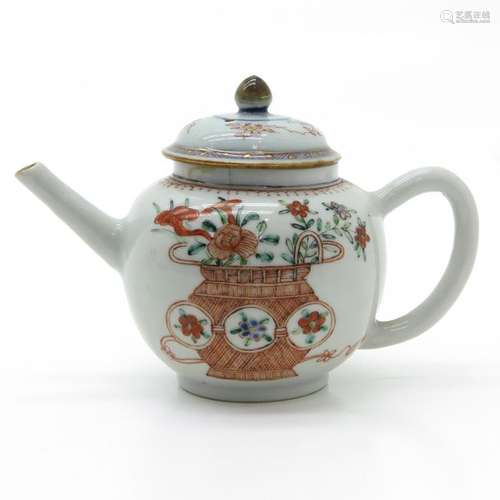 A Polychrome Decor Teapot Depicting flowers in bas...