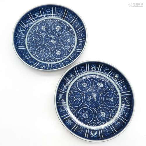 A Pair of Blue and White Plates Depicting flowers,...