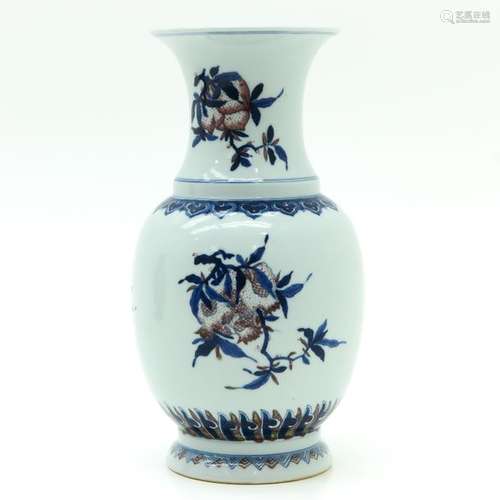 A Blue and White Decor Vase Depicting red fruit, m...