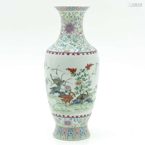 A Famille Rose Vase Depicting birds in garden with...