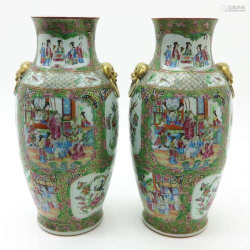 A Pair of Cantonese Vases Depicting alternating sc...