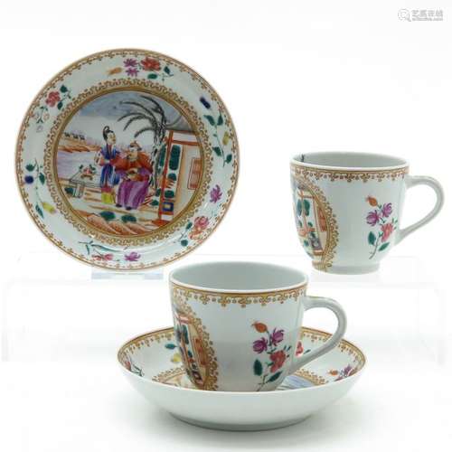 A Pair of Cups and Saucers Depicting Chinese man a...