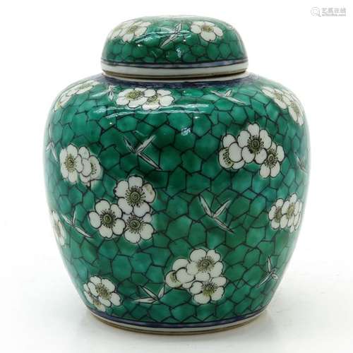 A Ginger Jar Green ground with white flower blosso...