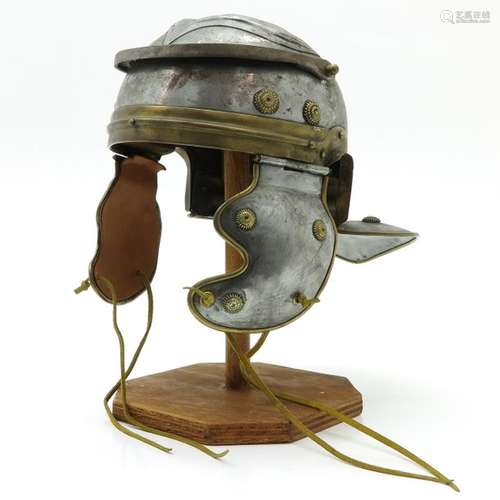 A Helmet Replica, 25 cm. High.		A Helmet Replica,...