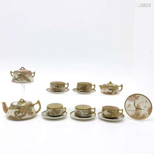 A Satsuma Tea Set Including 2 teapots, creamer, su...