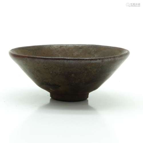 A Brown Glaze Tea Bowl On small circular foot, 12 ...