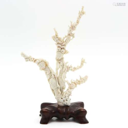 A Carved White Coral Sculpture on Wood Base Depict...