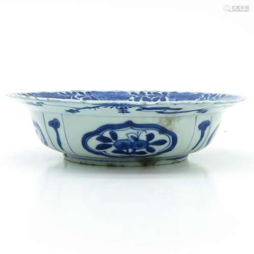 A Blue and White Bowl Depicting flowers and scroll...