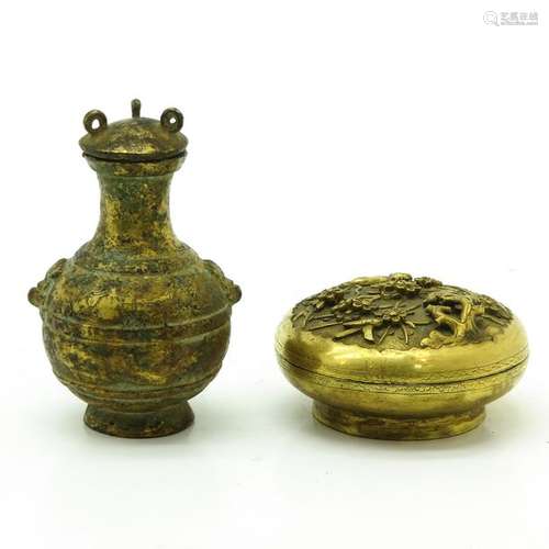 A Small Bronze Covered Jar and Covered Jar Covered...