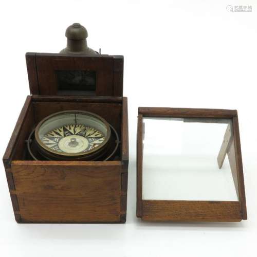 A 19th Century Compass With lighting, 25 cm. Tall....
