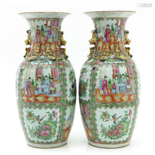 A Pair of Cantonese Vases Fully decorated depictin...