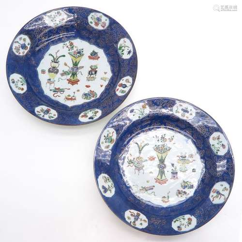 A Pair of Blue Chargers Depicting flowers in vases...