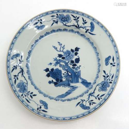 A Blue and White Plate Depicting garden with flowe...