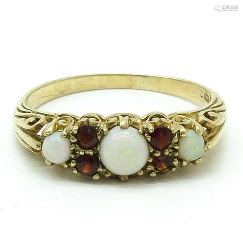 A 14KG Ladies Opal and Ruby Ring Ring size 20.		A...