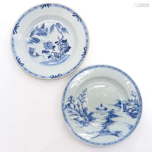 A Lot of 2 Blue and White Plates Both in landscape...