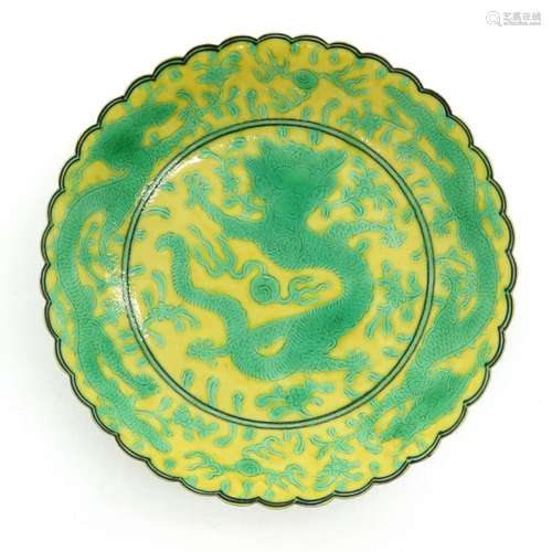 A Yellow and Green Dragon Decor Plate Depicting dr...