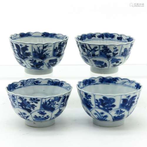 A Series of 4 Blue and White Cups Scalloped edge w...