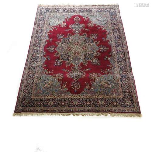 A Wool and Cotton Antique Kirman Carpet South east...