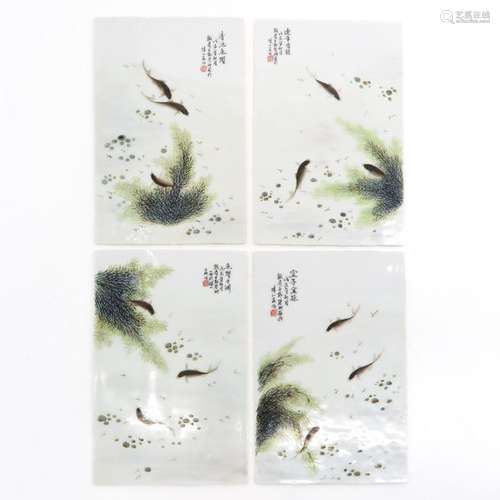 A Series of 4 Chinese Tiles Depicting fish with si...