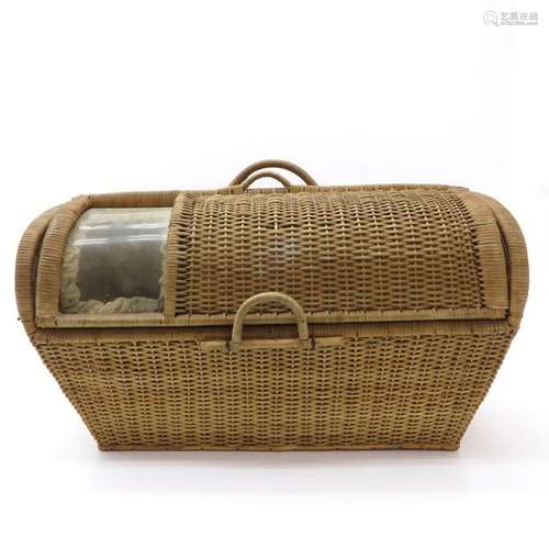 A Wicker Traveling Cot 75 cm. Long.		A Wicker Tra...