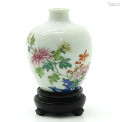 A Small Famille Rose Vase on Wood Base Depicting f...