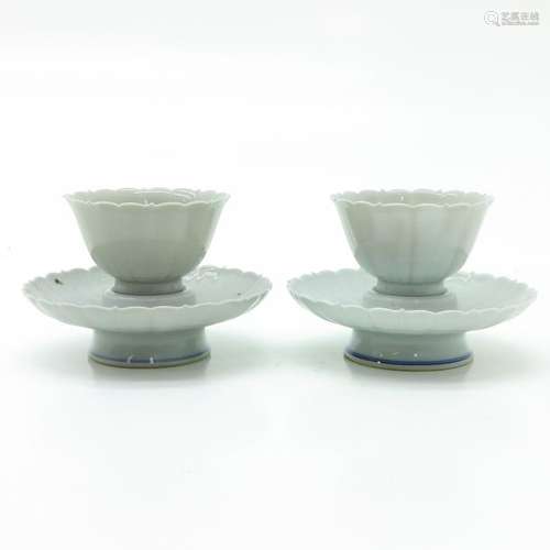 A Pair of Blanc de Chine Decor Cups and Saucers Lo...