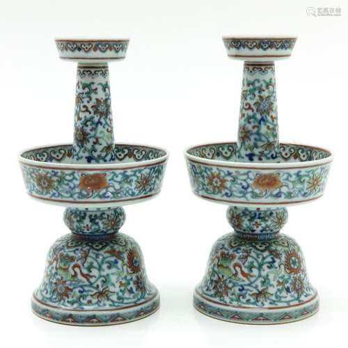 A Pair of Doucai Decorated Candlesticks Floral dec...