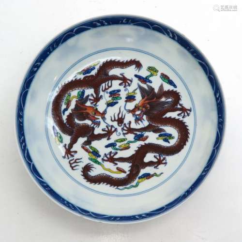 A Polychrome Decor Plate Depicting dragons and clo...
