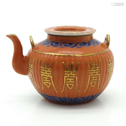 An Orange and Blue Decor Teapot Chinese symbols in...