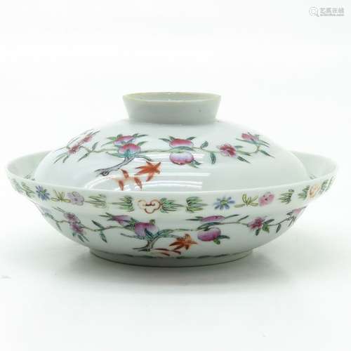 A Famille Rose Bowl with Cover Depicting peaches a...